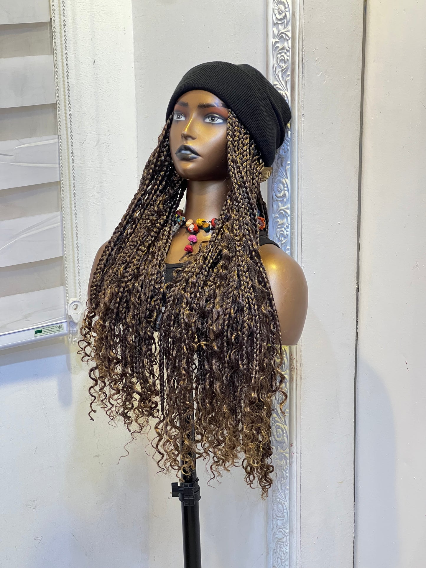 Black beanie on brown medium length boho braids