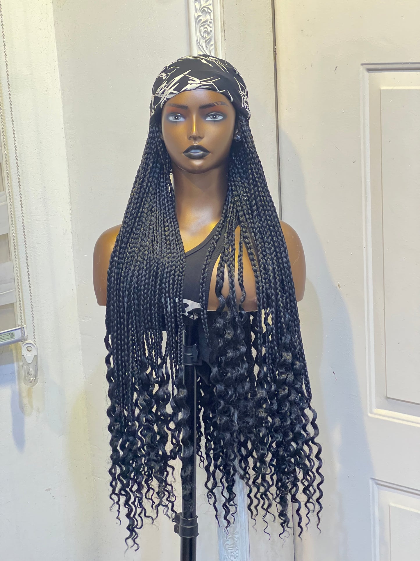Black braids on black and white scarf