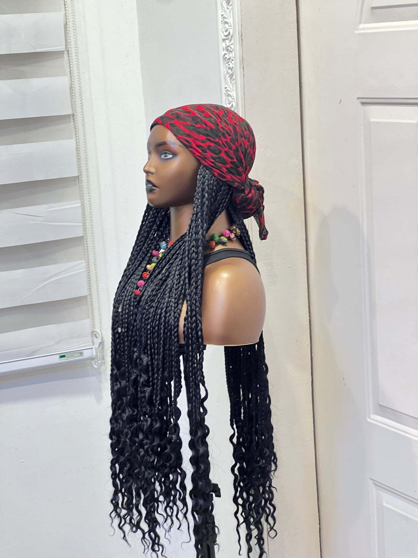 Black braids on red scarf