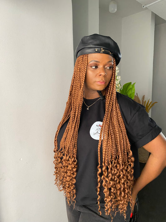 Black beret on brown braids