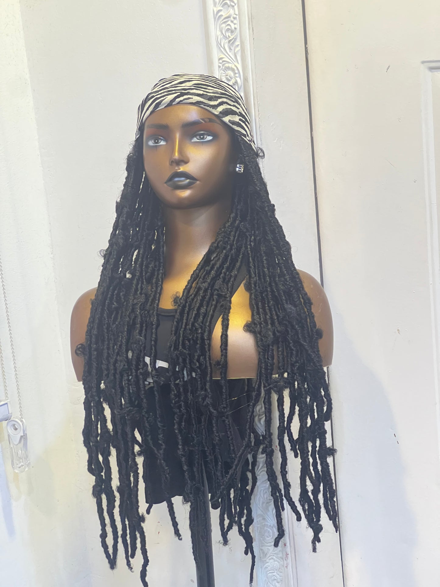 Black butterfly locs in scarf