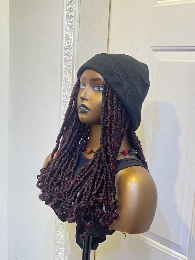 Black beanie on burgundy dreads