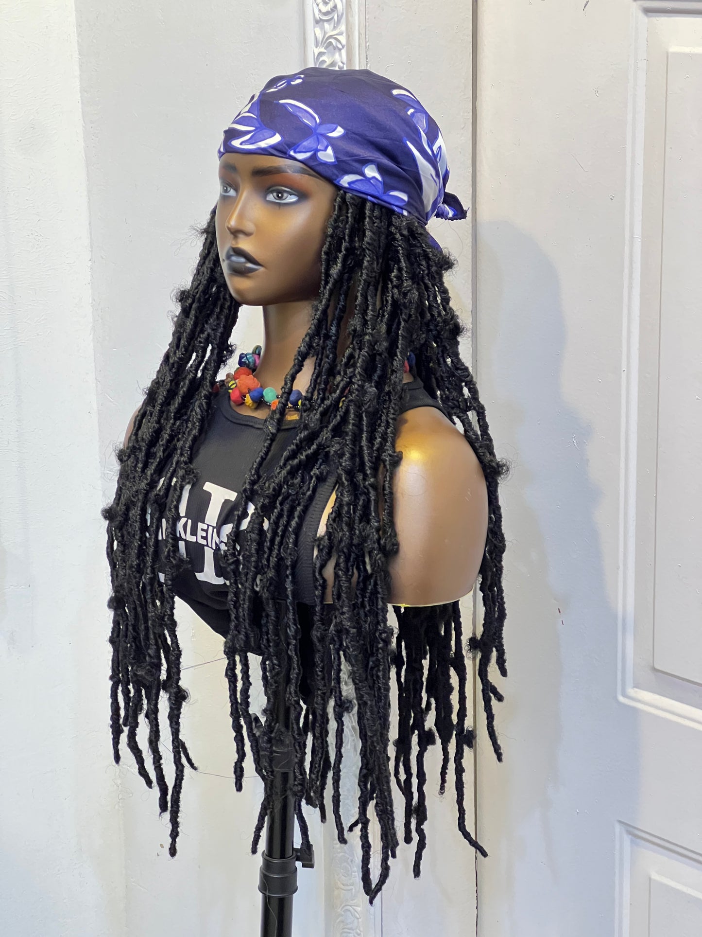 Black butterfly locs on blue scarf