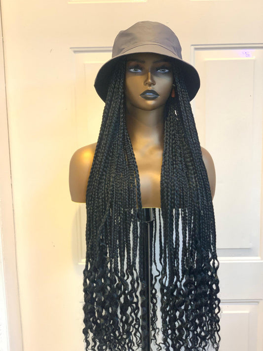 Grey bucket hat on black braids