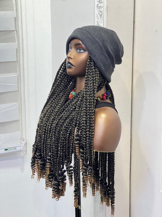 Grey beanie on brown boss braids