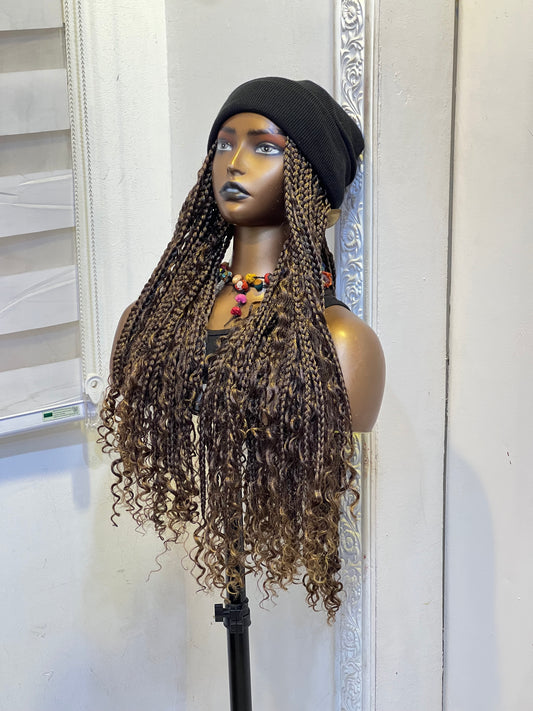 Black beanie on brown medium length boho braids