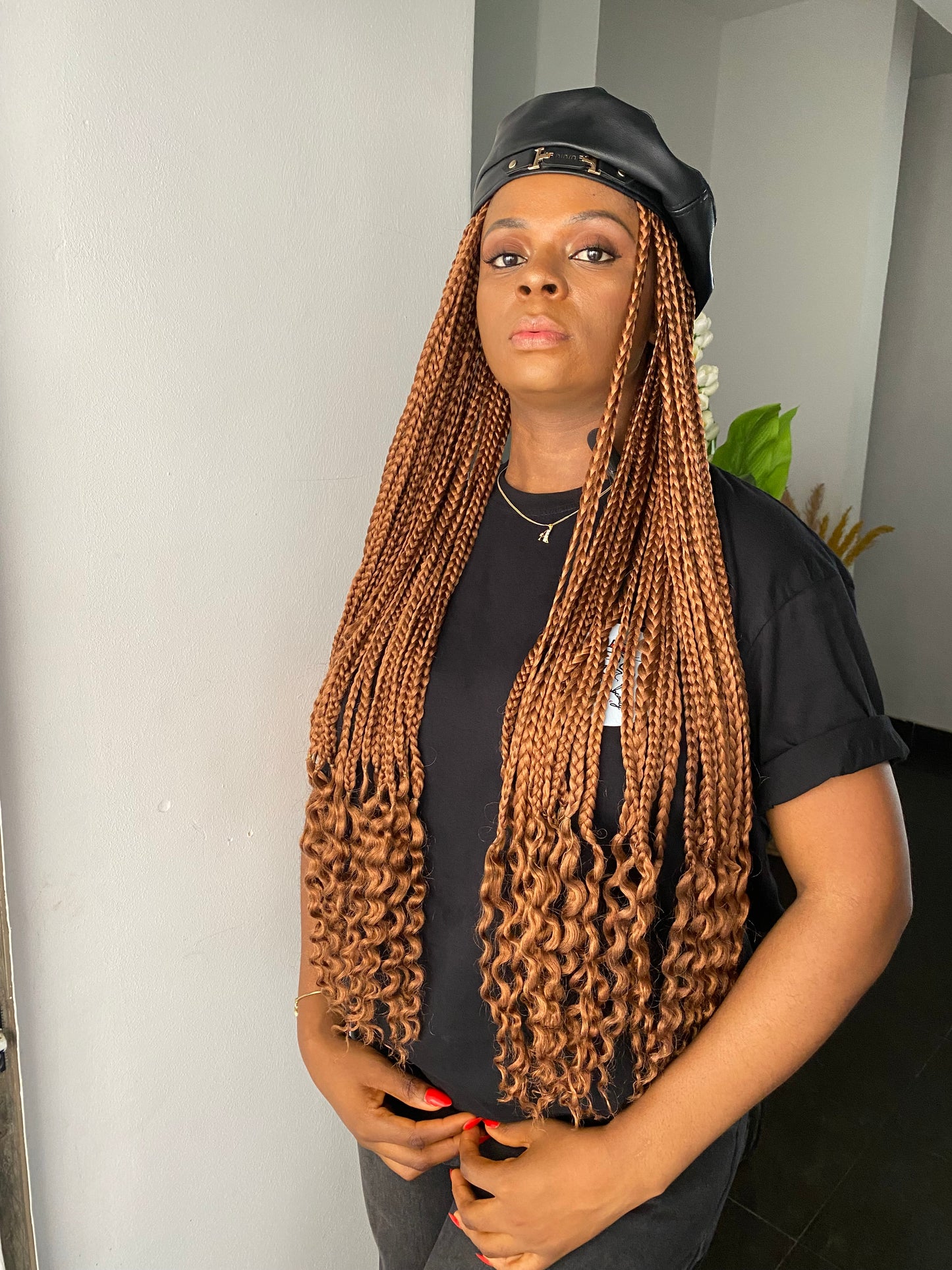 Black beret on brown braids