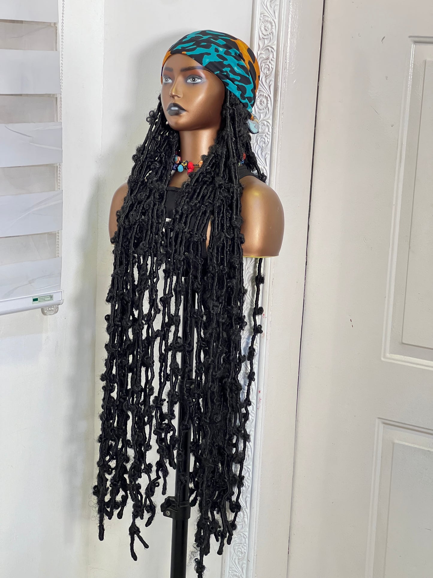 Extra length locs on green scarf