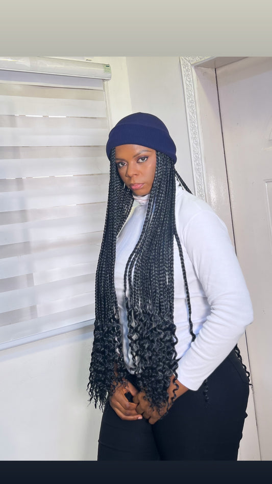 Navy blue beanie on black braids