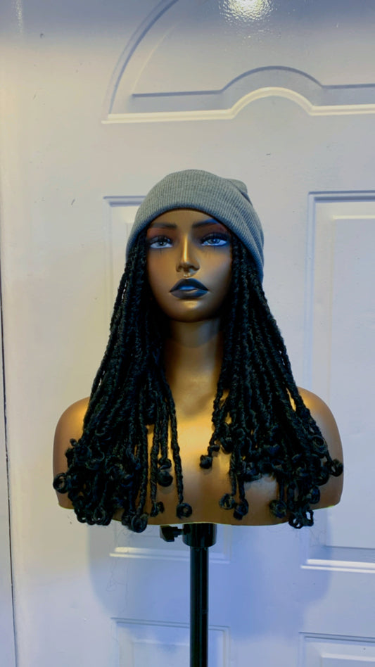 Grey beanie on short black dreads