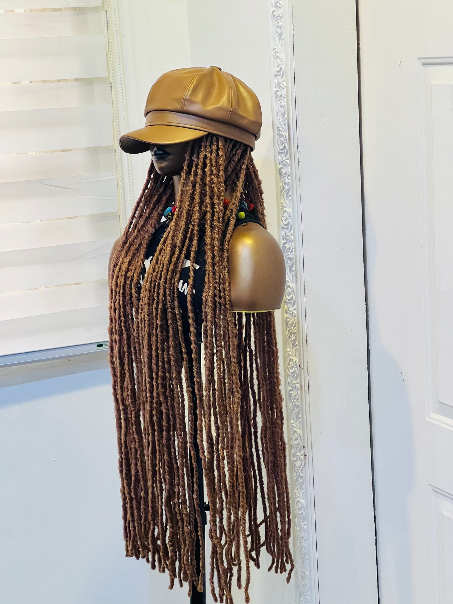 Nude premium hat on long brown dreads