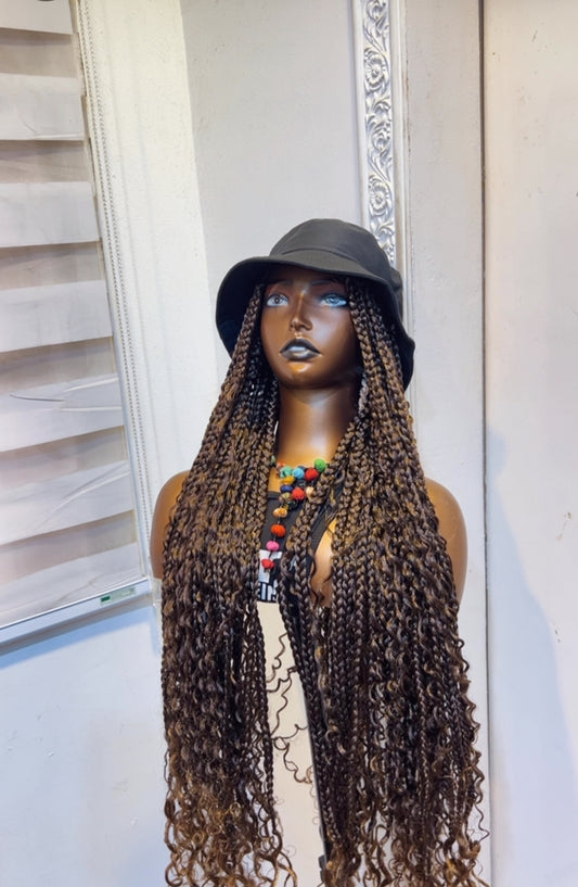 Black bucket hat on coffee brown boho braids