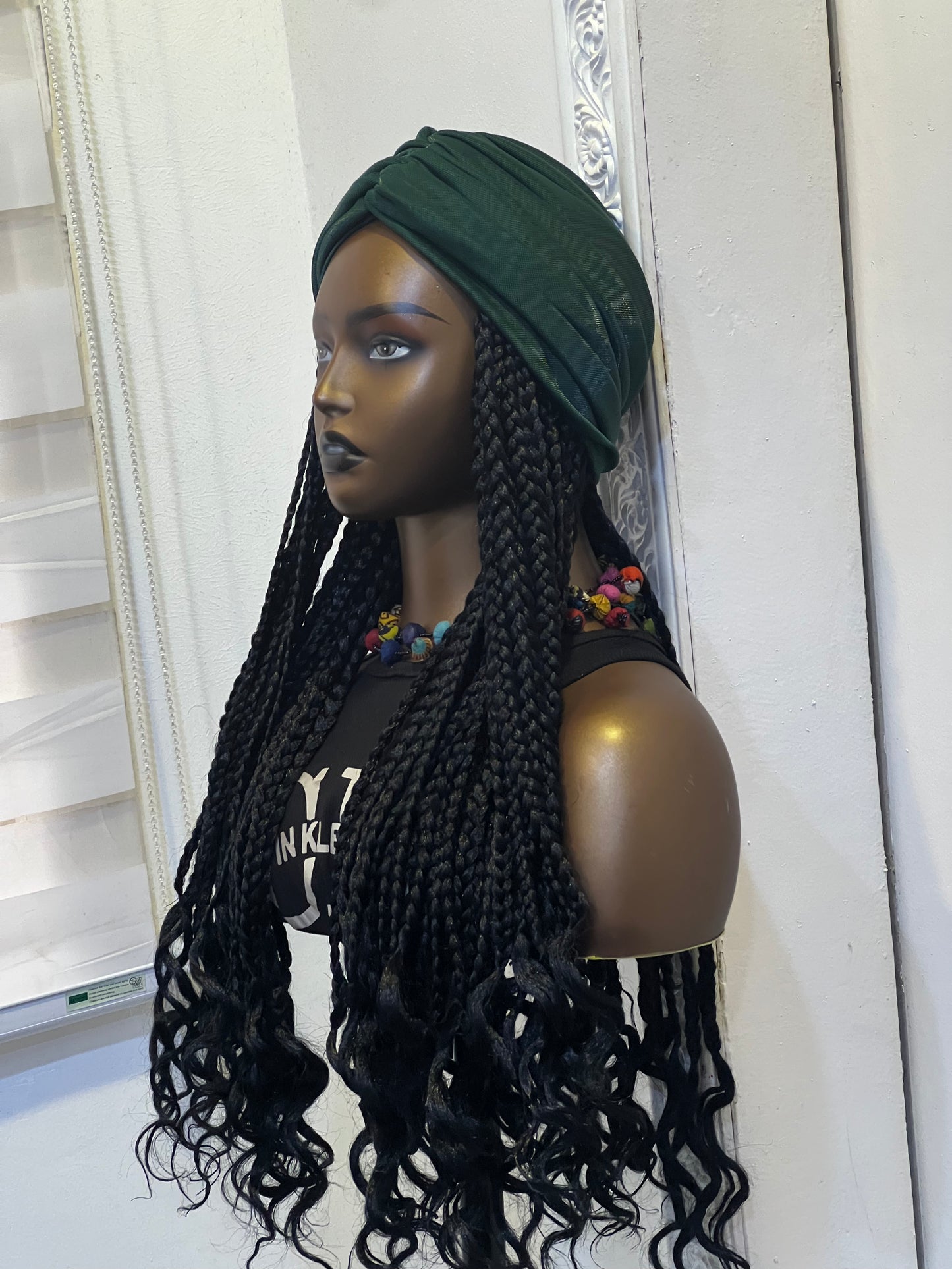 Green turban on short braids